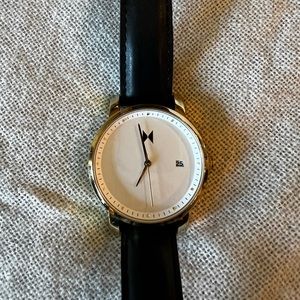 MVMT black and gold watch